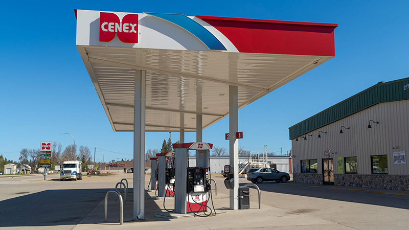 Middle River Co-op Oil Cenex gas station with fuel pumps under a red and white canopy beside the convenience store